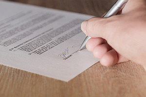 Person Signing Lease Contract