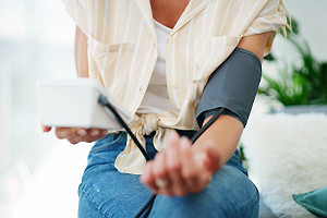 Woman Taking Blood  Pressure Reading